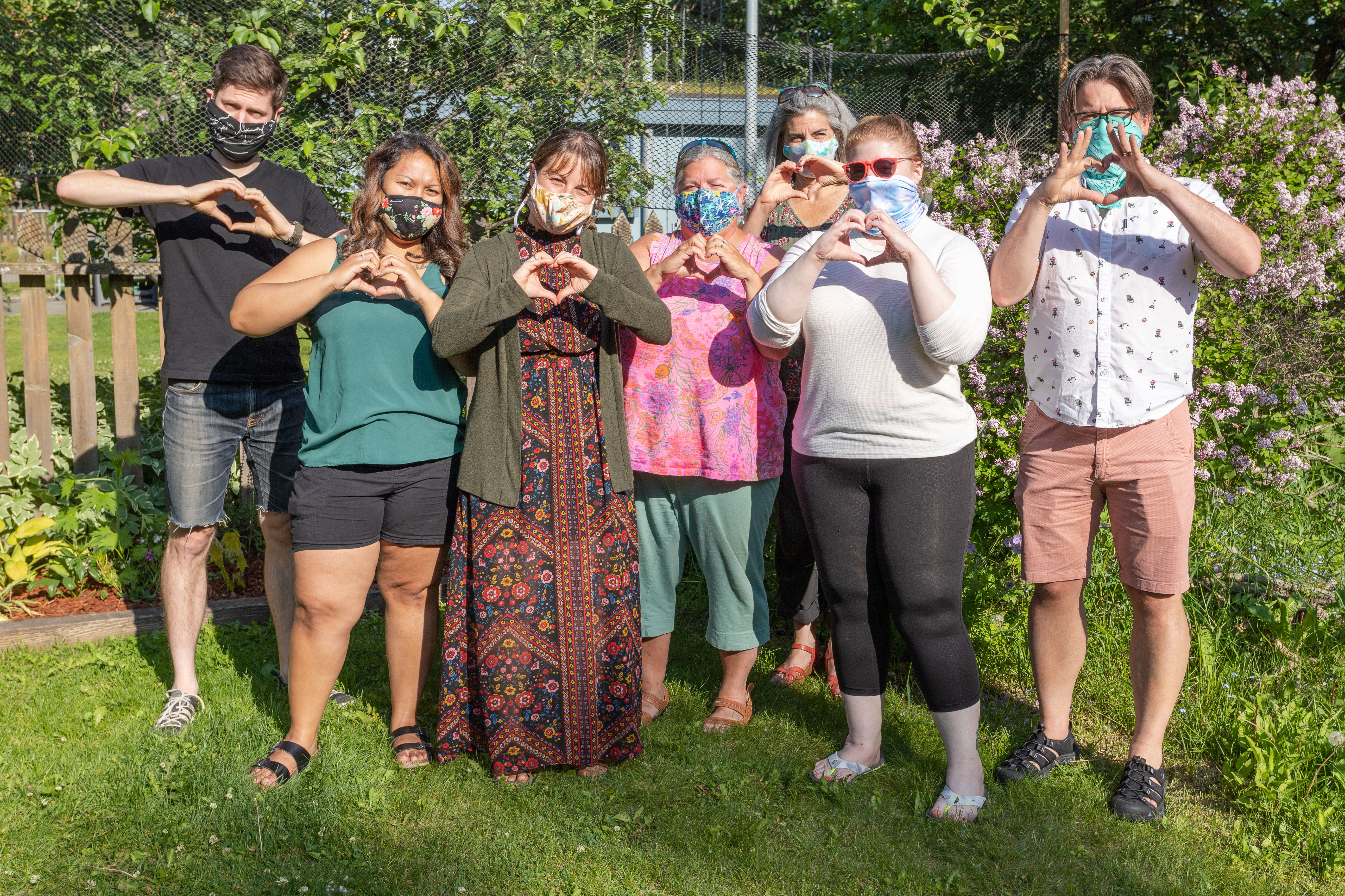 ACA staff trying their best to look joyful while wearing masks but you can't see their smiles. 